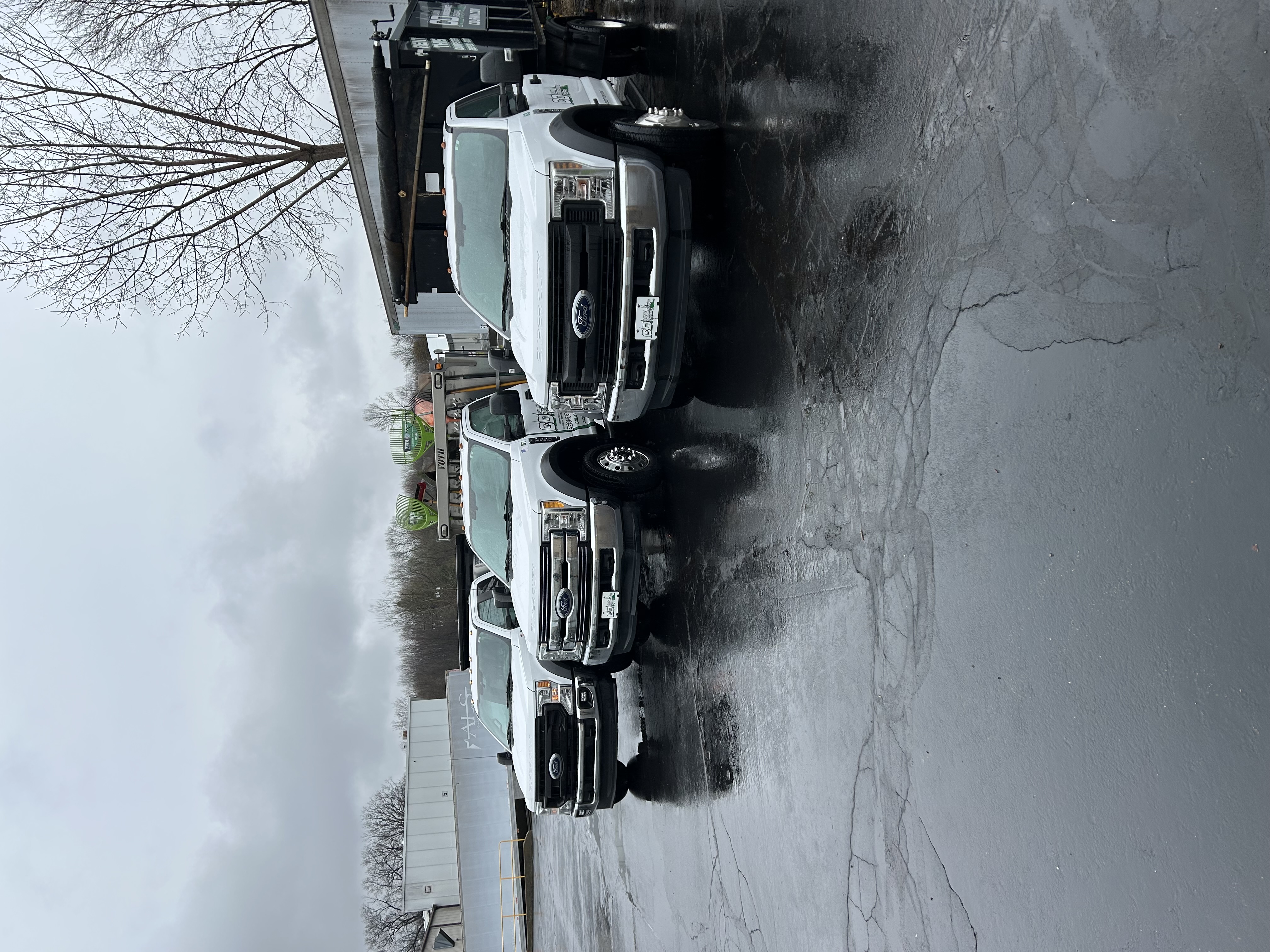 Fleet of Ford work trucks lined up after detailing